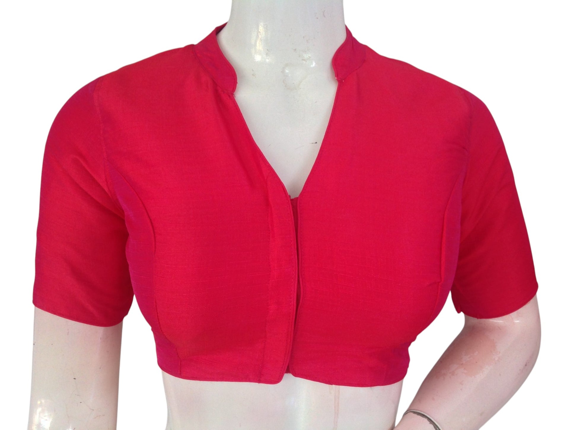 Pink semi raw silk collar neck saree blouse with cotton lining. Stitched, padded, ready to wear in sizes 34β40. Perfect for weddings & festive sarees.