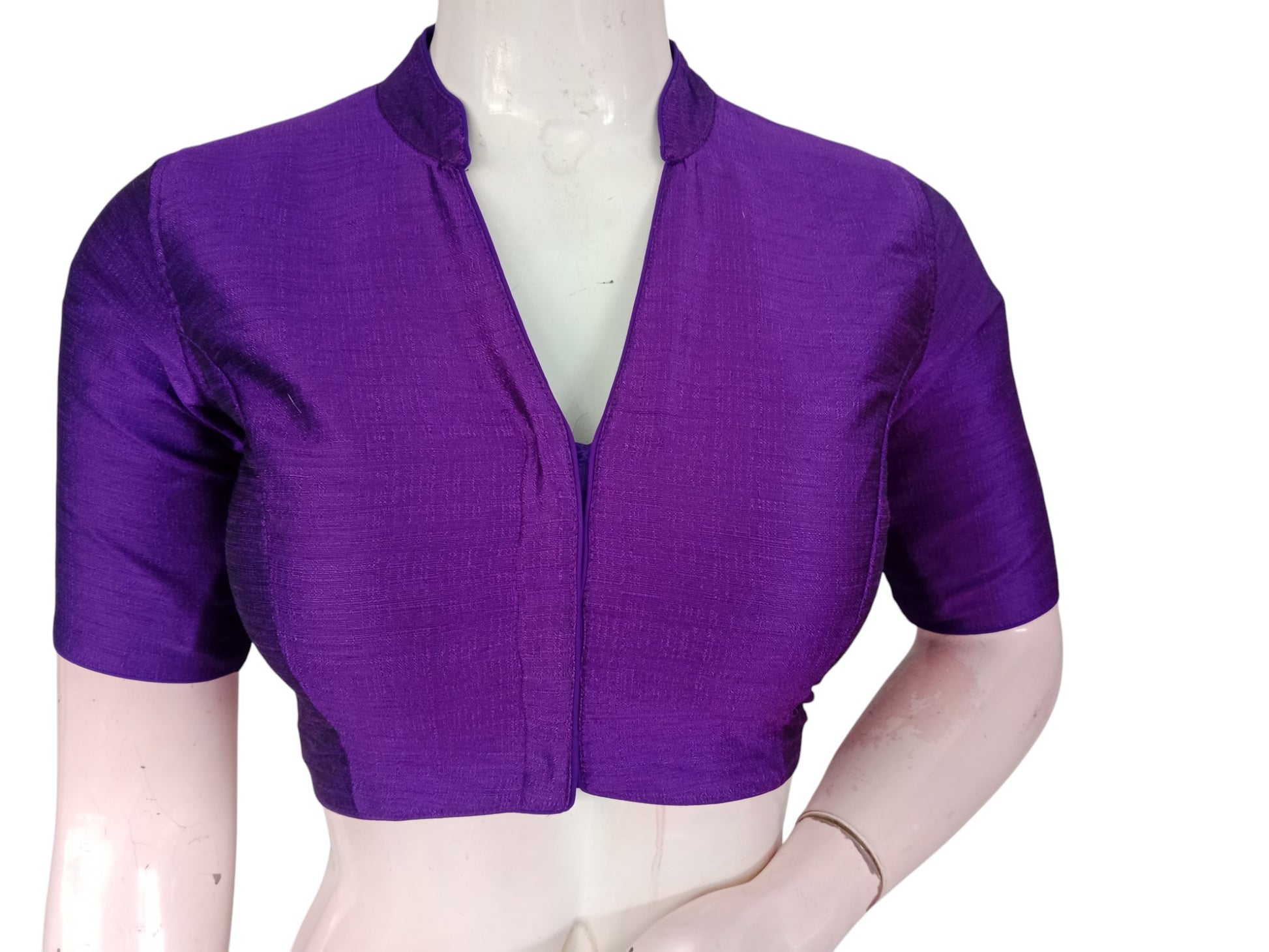 Purple semi raw silk collar neck saree blouse with cotton lining. Stitched, padded, ready to wear in sizes 34β40. Perfect for weddings & festive sarees.