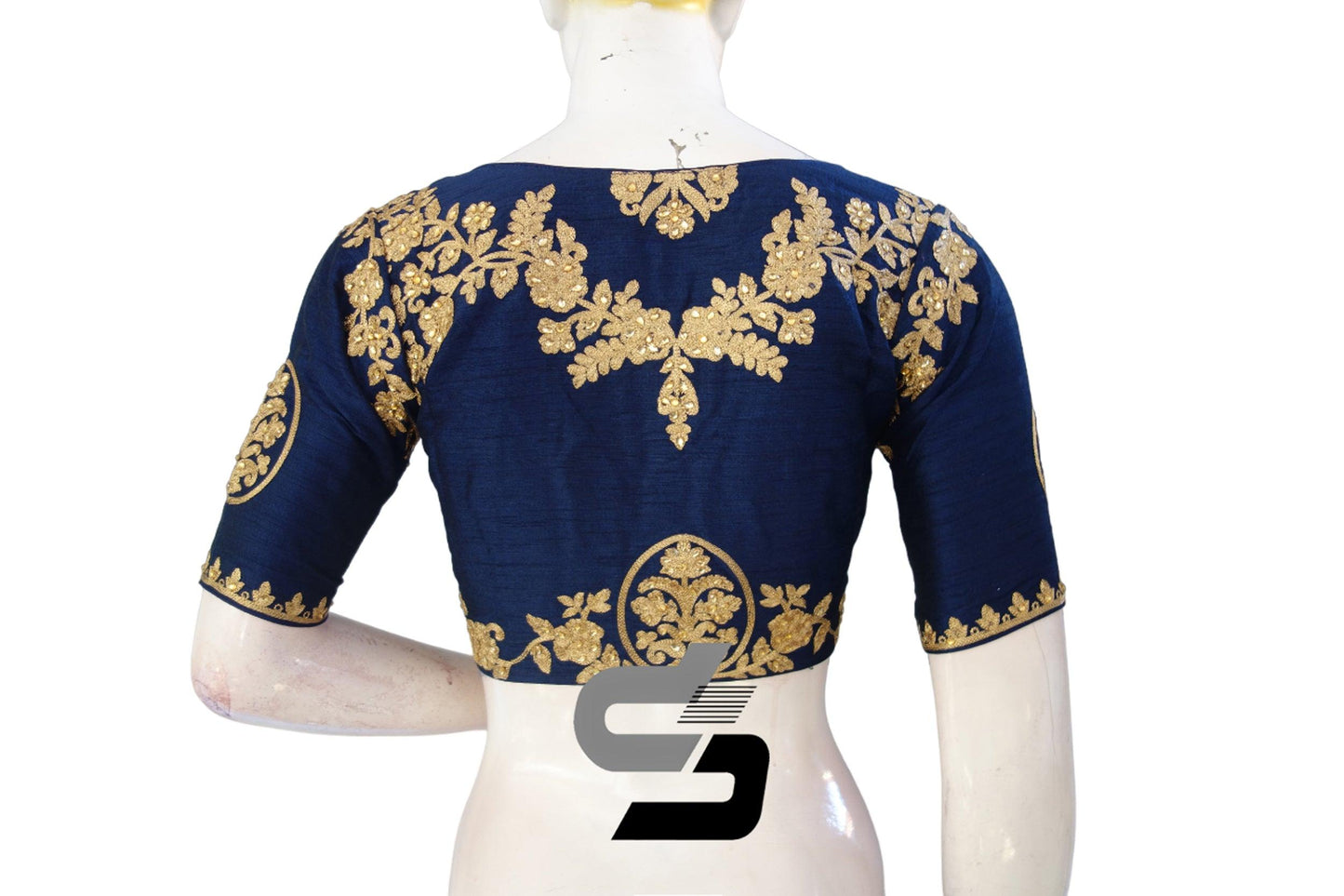 Command attention with our Navy Blue High Neck Designer Embroidered Saree Blouses. Vibrant and commanding, they elevate your style with bold hues and intricate embroidery.