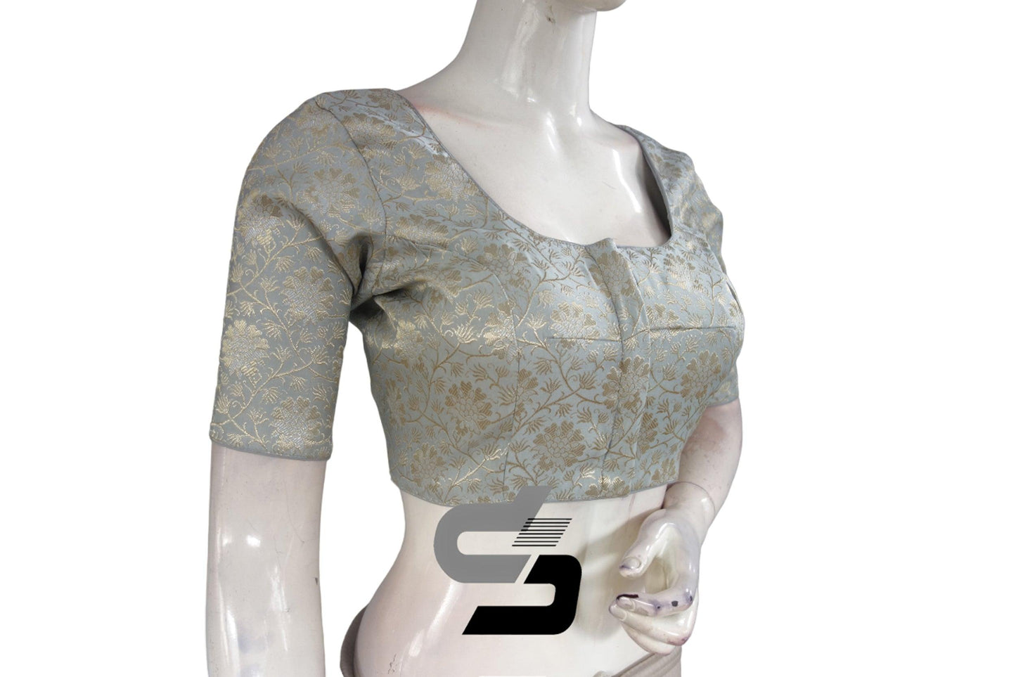 Indulge in sophistication with our Grey-Silver Mix Premium Brocade Silk Readymade Saree Blouse. Crafted meticulously, this blouse adds an elegant touch to your ethnic ensemble, enhancing your style with its premium design.