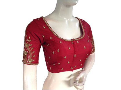Indulge in the regal charm of our Majestic Maroon Bridal Handwork Saree Blouse, a masterpiece of Traditional Indian Ethnic Attire. Its intricate handwork and rich hue exude a sense of grandeur, making it the perfect complement to your bridal ensemble.
