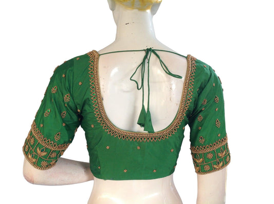 Step into enchanting elegance with our Green Bridal Handwork Saree Blouse, tailored for the traditional Indian Wedding Attire. Elevate your bridal look with its exquisite craftsmanship and timeless appeal.