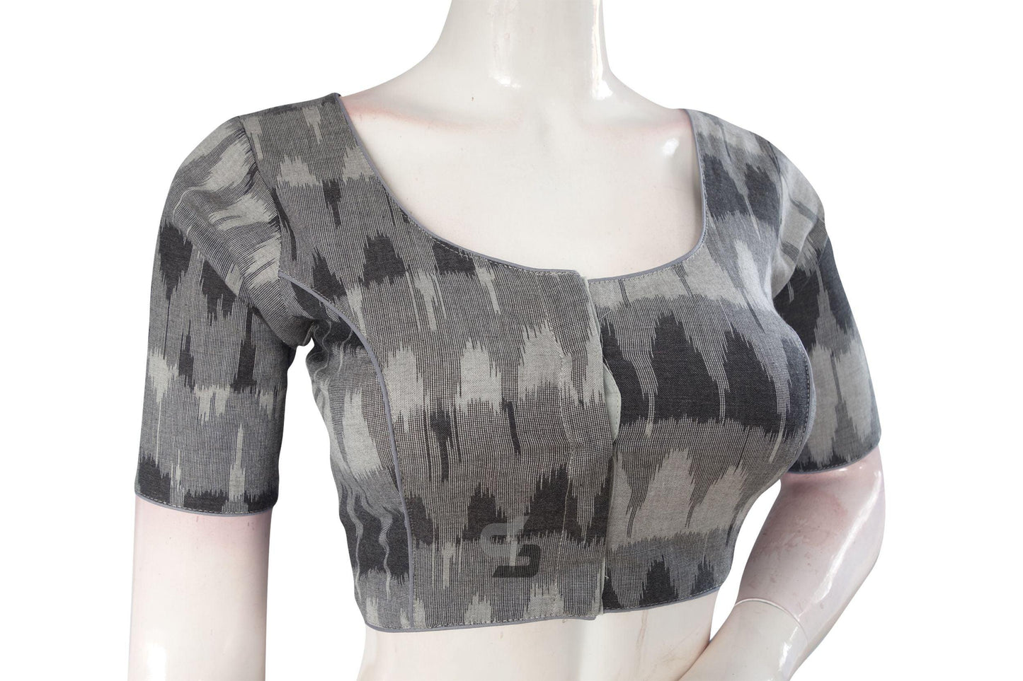 Elevate your style with our classic and chic Grey Ikkat Cotton Readymade Blouse. This versatile piece effortlessly combines timeless elegance with contemporary flair, making it a wardrobe essential for any occasion.