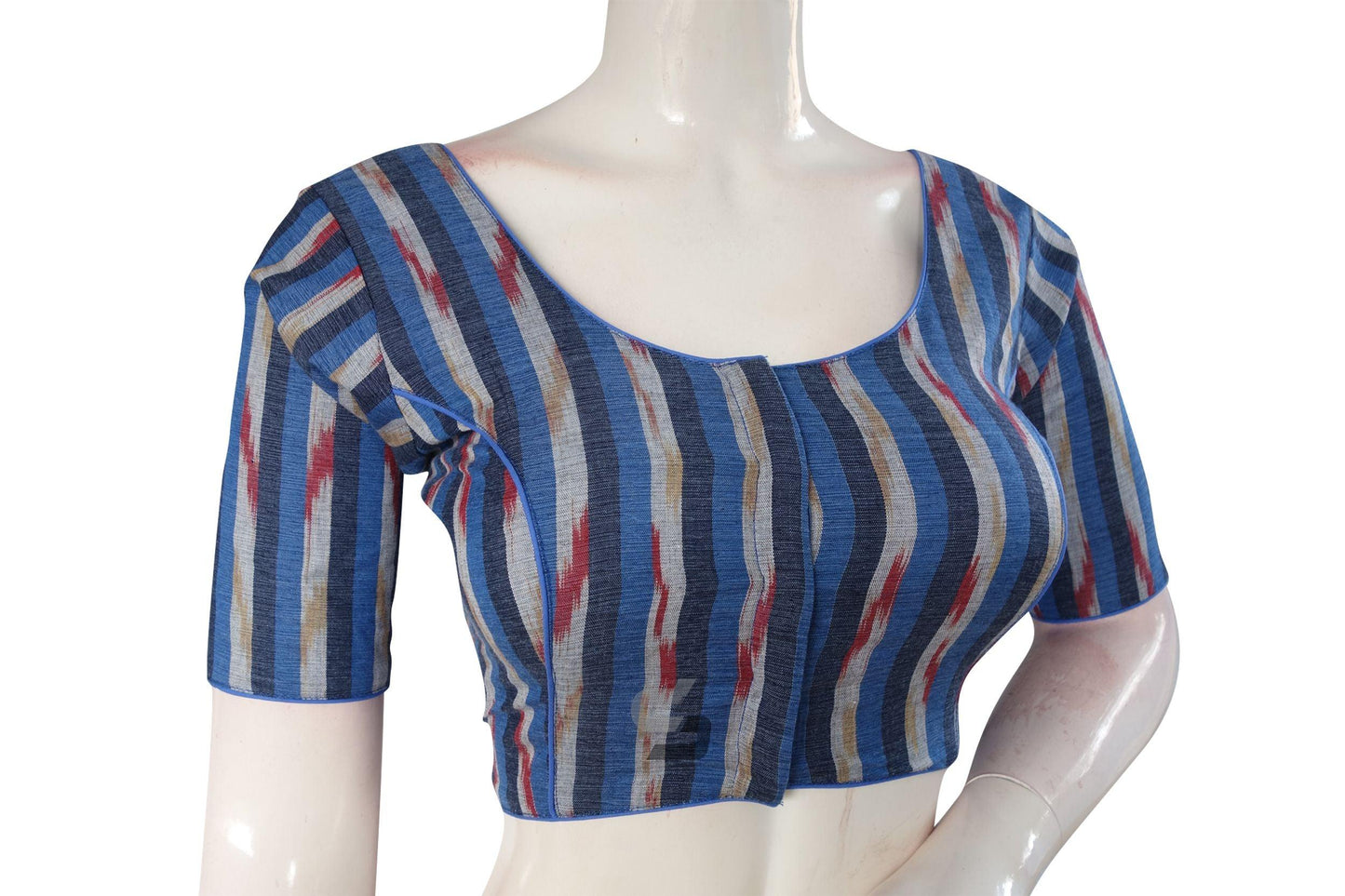 Enhance your ethnic attire with our vibrant Navy Blue Multi-Color Ikkat Cotton Readymade Saree Blouse. Its striking colors and intricate design make it a perfect choice to add a touch of elegance to your ensemble.