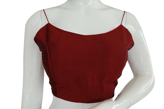 Embrace elegance with our 'Maroon Marvel' plain sleeveless readymade saree blouse featuring delicate spaghetti straps. Crafted in rich maroon, this blouse exudes sophistication, making it a timeless choice for any occasion