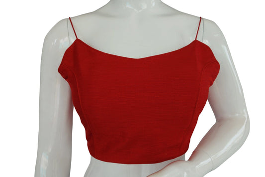 Scarlet Sensation: Make a statement with our red plain sleeveless readymade saree blouse, adorned with delicate spaghetti straps. Effortlessly chic and versatile, this piece adds a touch of bold elegance to any ensemble, perfect for various occasions.
