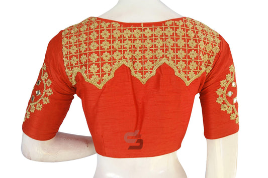 Infuse your look with designer charm wearing our Vibrant Orange Embroidered High Neck Saree Blouse, radiating sophistication and allure with every stitch.