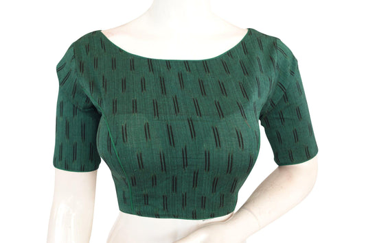 Elevate your saree game with our Green Boat Neck Ikkat Cotton Readymade Saree Blouses. Crafted for style and comfort, these blouses add a touch of elegance to your ensemble. Perfect for any occasion, they are sure to make you stand out in the crowd. Upgrade your wardrobe with these chic and trendy pieces today!