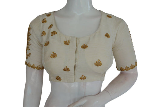 Complete your ethnic ensemble with our White High Neck Embroidered Readymade Blouse, adorned with exquisite mirror detailing and fashioned in the traditional Indian crop top style, radiating elegance and charm.