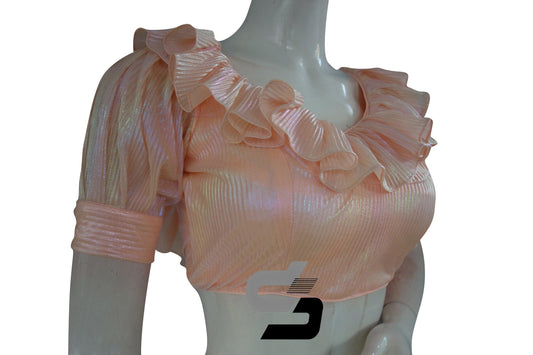 Wrap yourself in sophistication with our Soft Peach Pre-Pleated Saree Blouse, featuring a charming frill neckline and graceful puff sleeves for an elegant and trendy ensemble.