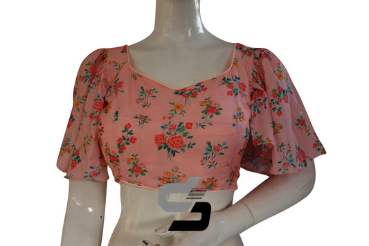 Indulge in the delicate beauty of "Peach Petals" with our Designer Organza Ruffle Sleeve Saree Blouse, exuding grace and sophistication with its charming ruffle sleeves.