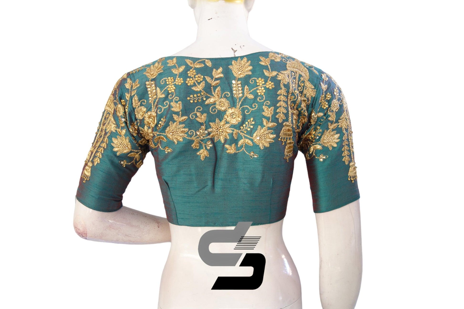 Indulge in vivid elegance with our Teal High Neck Designer Embroidered Saree Blouses. Elevate your ensemble with stunning teal hues and intricate embroidery.