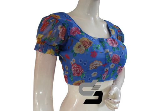Capture the essence of the ocean with our "Ocean Breeze" Blue Organza Fancy Frill Puff Sleeves Blouse for Sarees, exuding elegance and grace with its charming frills and puff sleeves.