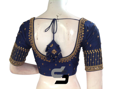 Adorn yourself in the elegance of our Regal Navy Blue Bridal Handwork Saree Blouse, a symbol of Traditional Indian Ethnic Attire. With its exquisite handwork and deep hue, it exudes regal charm, adding a touch of sophistication to your bridal ensemble.