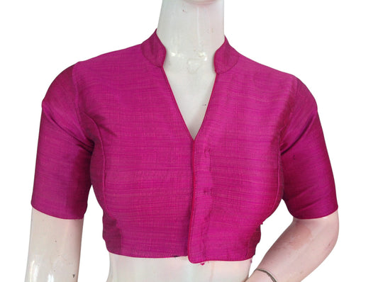 Magenta semi raw silk collar neck saree blouse with cotton lining. Stitched, padded, ready to wear in sizes 34–40. Perfect for weddings & festive sarees.