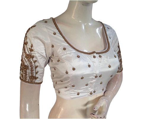 Step into timeless elegance with our Graceful White Bridal Handwork Saree Blouse, the epitome of Ethnic Indian Wedding Attire. Adorned with intricate details, it adds a touch of grace and sophistication to your bridal ensemble.