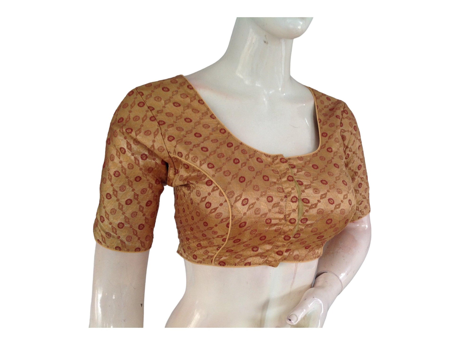 Elevate your ethnic ensemble with our Gold Brocade Readymade Saree Blouse, available online as part of our Indian Ethnic Blouse collection. Crafted with intricate detailing, this blouse adds a touch of elegance and opulence to your attire, perfect for making a statement at any cultural event.