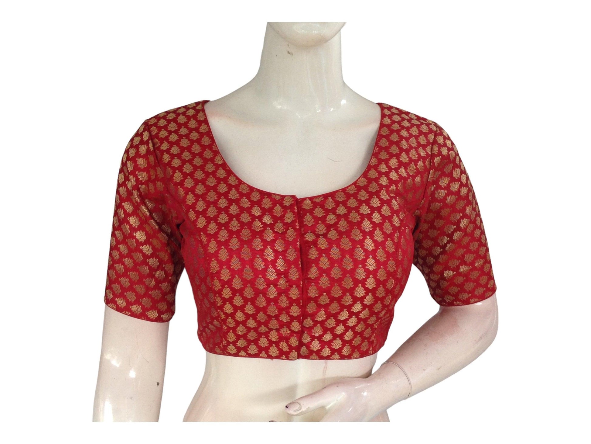 Enhance your ethnic ensemble with our Red Banaras Brocade Readymade Saree Blouse, available in our Indian Ethnic Wear collection online. Crafted with intricate Banaras brocade, this blouse adds a touch of traditional charm to your attire, perfect for any special occasion.