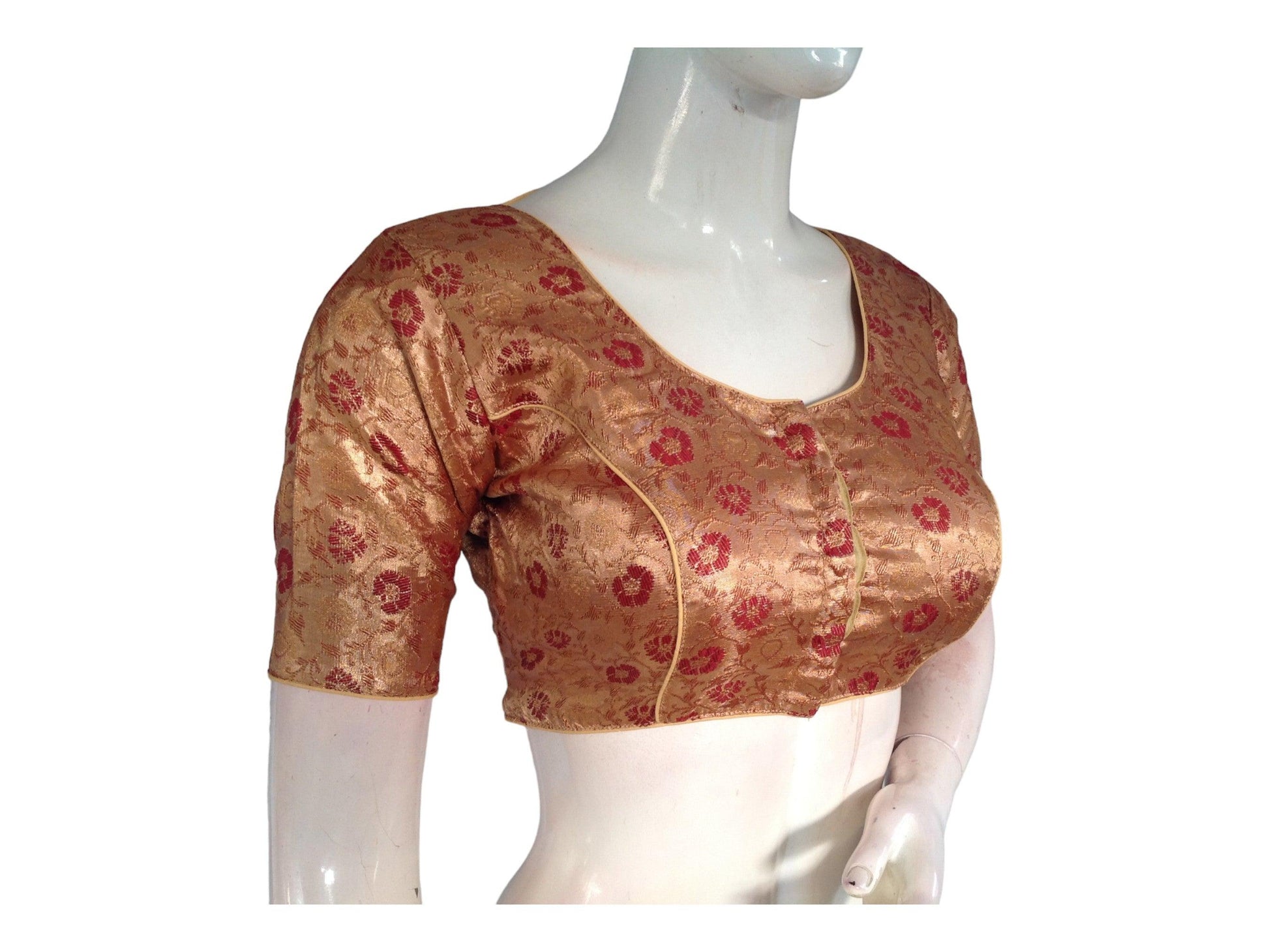 Elevate your ethnic elegance with our Gold Brocade Readymade Saree Blouse, a stunning addition to our Indian Ethnic Saree Blouse collection. Crafted with intricate detailing, this blouse adds a touch of opulence to your ensemble, perfect for making a statement at any special occasion.