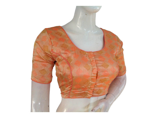 Adorn yourself with elegance in our Peach Brocade Readymade Saree Blouse, a timeless piece from our Indian Traditional Blouse collection. Crafted with intricate brocade detailing, this blouse adds a touch of sophistication to your ensemble, perfect for embracing tradition with grace and style.