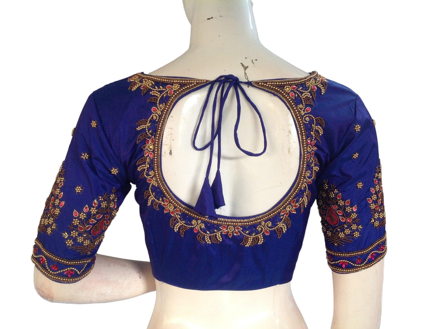 Indulge in regal elegance with our Blue Bridal Handwork Saree Blouse, designed for the traditional Indian Wedding Blouse. Elevate your bridal ensemble with its timeless charm and sophistication.