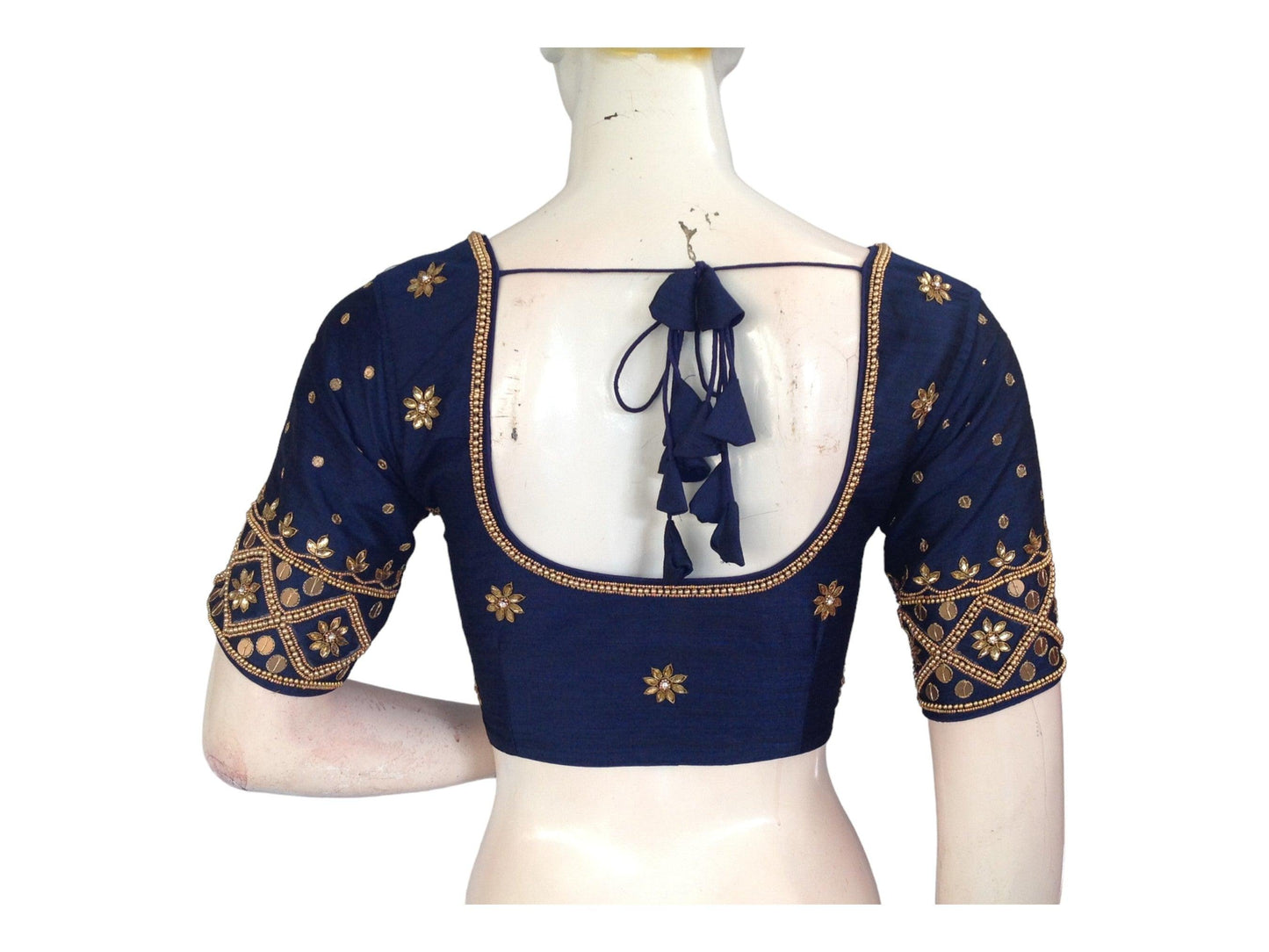 Indulge in timeless elegance with our Elegant Navy Blue Bridal Aari Handwork Saree Blouse, designed to elevate your traditional Indian Wedding Blouse ensemble. Shop now for a captivating bridal look!