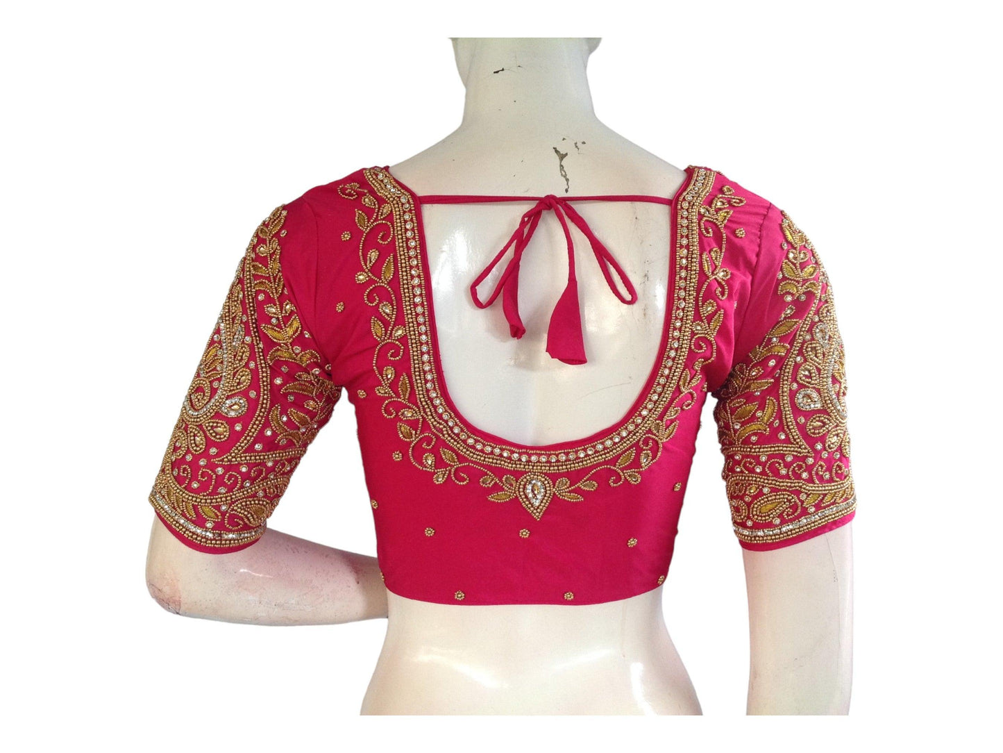 Enhance your bridal look with our elegant Pink Bridal Handwork Readymade Saree Blouse. Perfect for weddings, this blouse adds a touch of tradition and sophistication to your ethnic ensemble. Shop now for the perfect Indian Ethnic Wedding Choli Top.