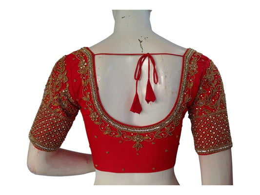 Elevate your bridal ensemble with our stunning Red Bridal Handwork Readymade Saree Blouse. Crafted intricately, this blouse adds elegance and charm to your wedding attire. Shop now for the perfect Indian Wedding Choli Top online.