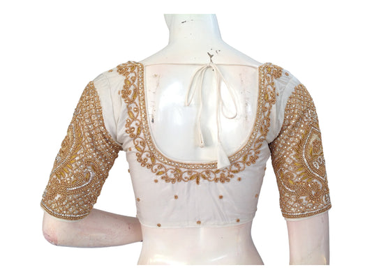 "Cream Elegance: Handcrafted Aari Bridal Silk Saree Readymade Blouse, featuring exquisite craftsmanship and luxurious design for a timeless bridal look."