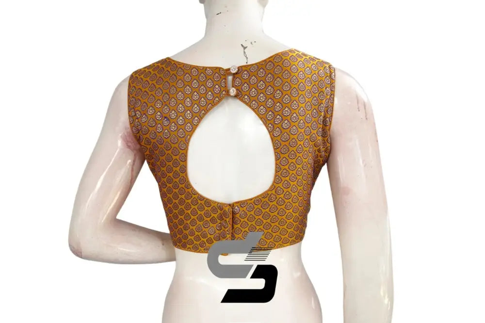 Back view of padded mustard saree blouse showing boat neck and back hooks