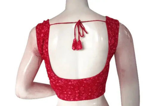 Close-up of handmade threadwork on a pink designer embroidery saree blouse.