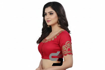 Close up of intricate floral embroidery on pink semi silk designer blouse