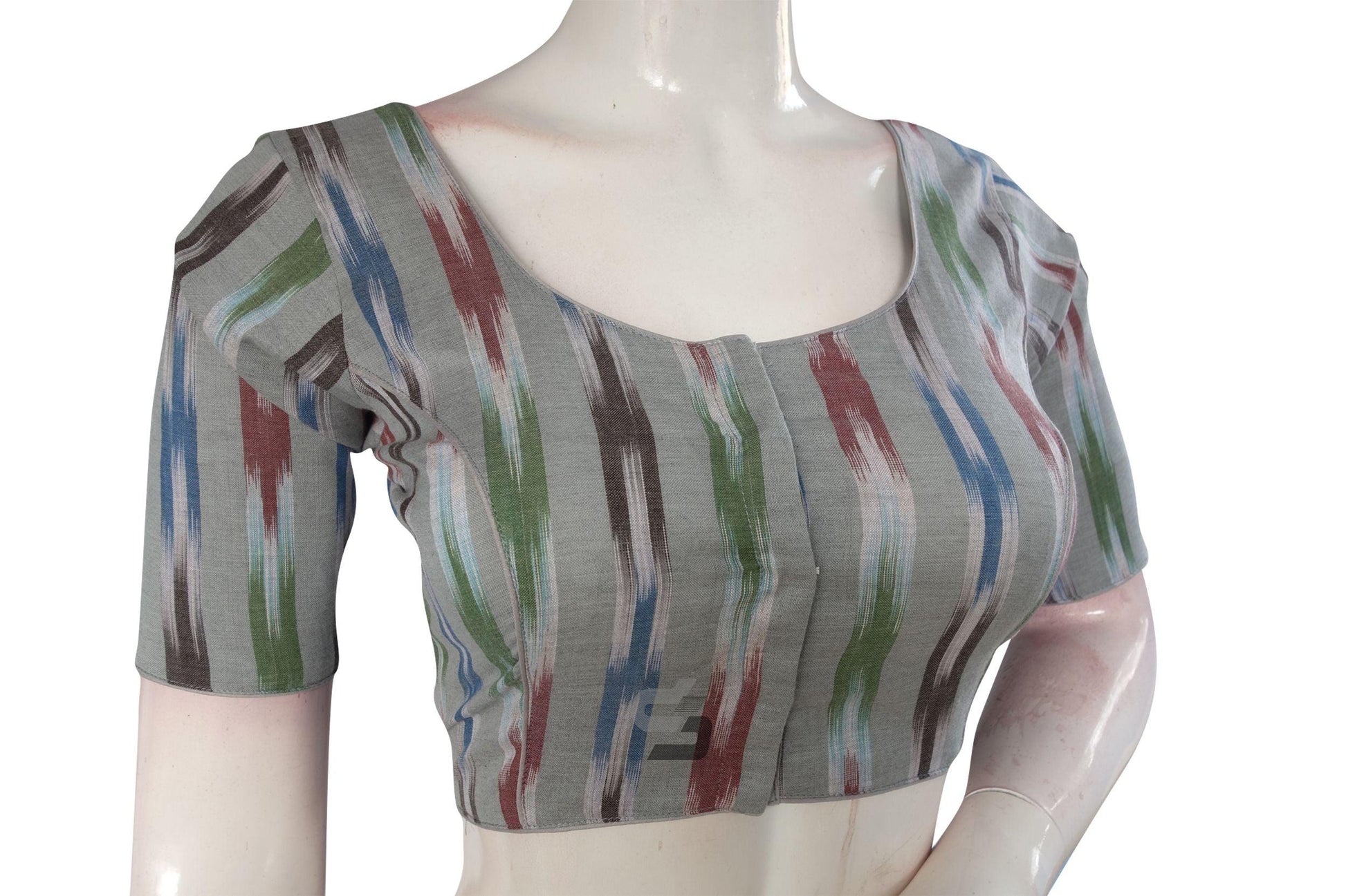 Elevate your ethnic ensemble effortlessly with our Grey Multi-Color Ikkat Cotton Readymade Saree Blouse. Its vibrant colors and intricate design add a touch of sophistication to your look, making it perfect for any occasion.