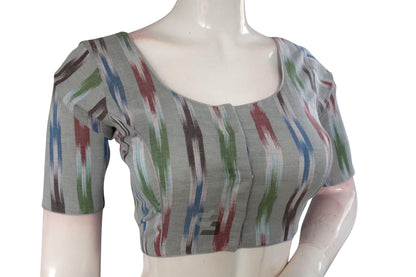 Elevate your ethnic ensemble effortlessly with our Grey Multi-Color Ikkat Cotton Readymade Saree Blouse. Its vibrant colors and intricate design add a touch of sophistication to your look, making it perfect for any occasion.