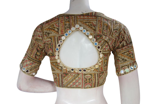 Elevate your ethnic ensemble with our beige Kalamkari cotton blouse, featuring intricate mirror work on the neck and sleeves. This ready-to-wear design effortlessly blends traditional craftsmanship with contemporary style, offering a unique statement piece for any occasion. Experience the charm of Kalamkari artistry in every detail, adding a touch of elegance to your look. Perfect for pairing with sarees or skirts, this versatile blouse is a must-have addition to your wardrobe.