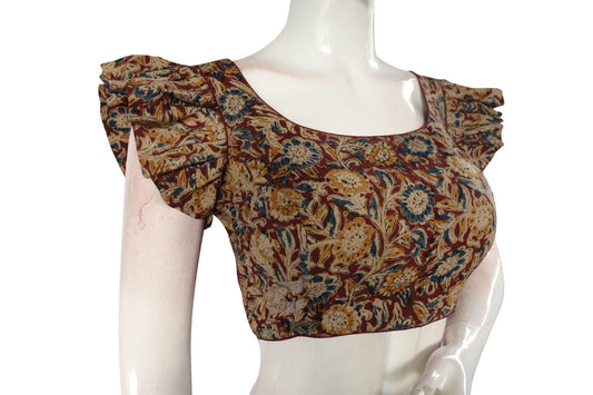 Elevate your elegance with "Crimson Elegance," our Maroon Kalamkari Cotton Blouse with Designer Ruffle Sleeves, exuding sophistication and charm with its stylish design and graceful ruffle sleeves.