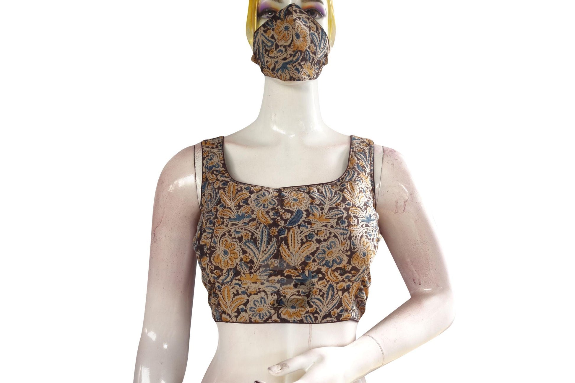 Embrace elegance with our chic brown Kalamkari designer blouse, complete with a matching mask. Ready-to-wear and exuding sophistication, it's the perfect blend of tradition and modernity.