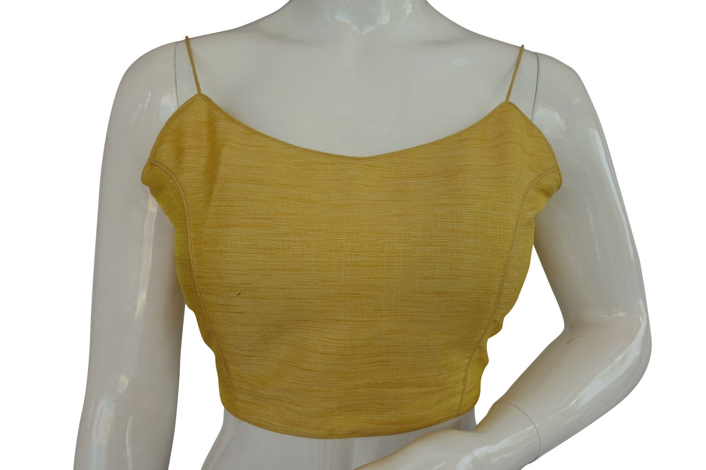 Elevate your style with our 'Banana Glow' plain sleeveless readymade saree blouse featuring delicate spaghetti straps. Crafted for comfort and elegance, this piece adds a vibrant touch to your ensemble, perfect for any occasion where you want to shine.