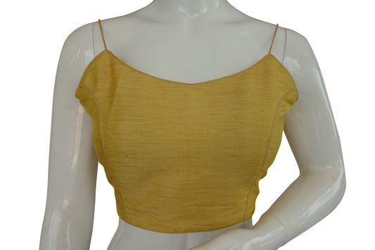 Elevate your style with our 'Banana Glow' plain sleeveless readymade saree blouse featuring delicate spaghetti straps. Crafted for comfort and elegance, this piece adds a vibrant touch to your ensemble, perfect for any occasion where you want to shine.