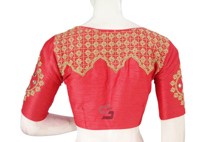 Indulge in designer elegance with our Peach Pink Embroidered High Neck Saree Blouse, showcasing intricate detailing and graceful charm for a sophisticated look.