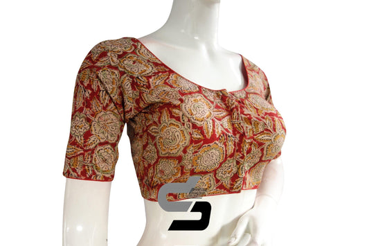 Indulge in timeless elegance with our classic Kalamkari cotton blouse, now available as a ready-made Indian attire online. Adorned with intricate Kalamkari patterns, this blouse seamlessly blends tradition with modernity. Crafted for both comfort and style, it's the perfect choice for any occasion, adding a touch of grace to your ensemble with just a click.
