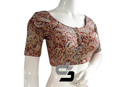 Elevate your style with our trendy Kalamkari crop top, a ready-made Indian saree blouse that combines traditional charm with contemporary flair. Crafted with intricate Kalamkari designs, this crop top adds a touch of elegance to your ensemble. Perfect for pairing with sarees or skirts, it's a versatile addition to your wardrobe for any occasion.
