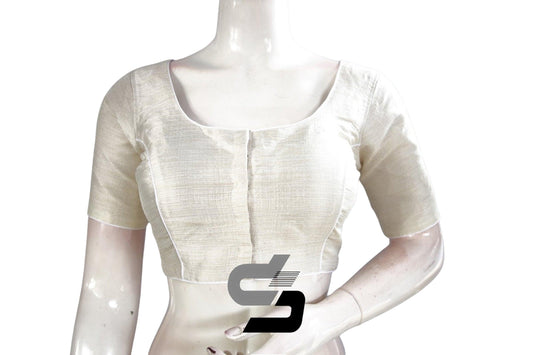 Classic White: Elevate your saree ensemble with this Semi Silk Plain Readymade Saree Blouse in timeless white. The understated elegance of this blouse complements any saree, while the semi-silk fabric offers comfort and style. Perfect for both casual and formal occasions, it's a versatile addition to your wardrobe.