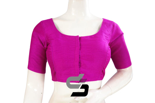Chic Magenta: Elevate your Indian ensemble with this Semi Silk Plain Readymade Saree Blouse. The vibrant magenta hue adds a pop of color to your look, while the simple yet stylish design exudes elegance. Perfect for adding a touch of sophistication to any saree ensemble.