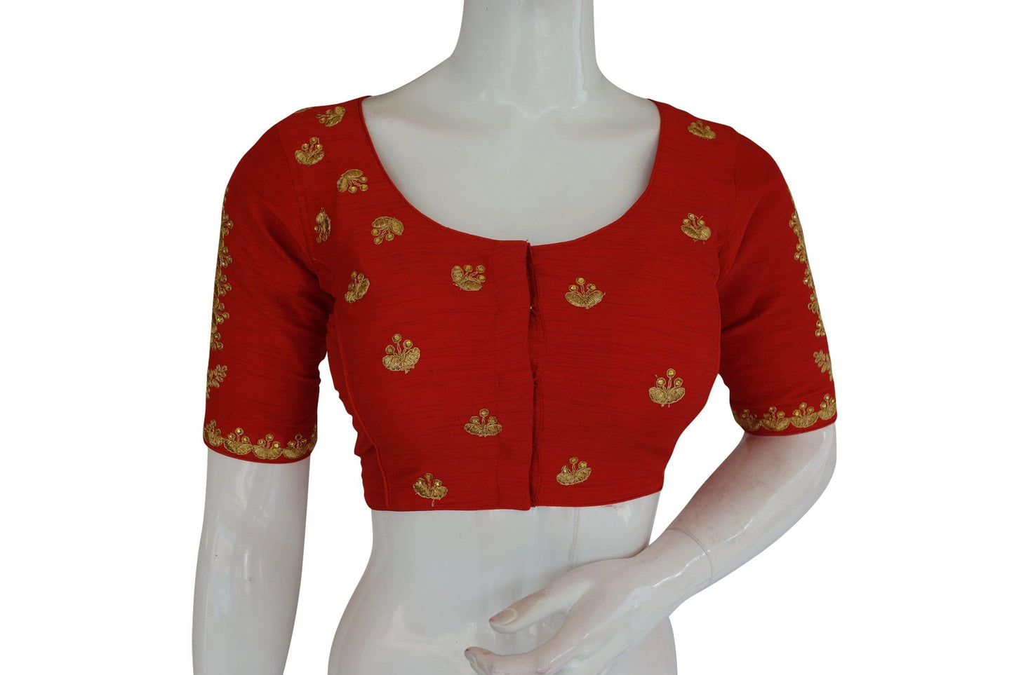 Make a bold statement with our Red High Neck Embroidered Readymade Blouse, adorned with intricate mirror detailing and styled in the traditional Indian crop top design, adding flair and elegance to your ethnic ensemble.