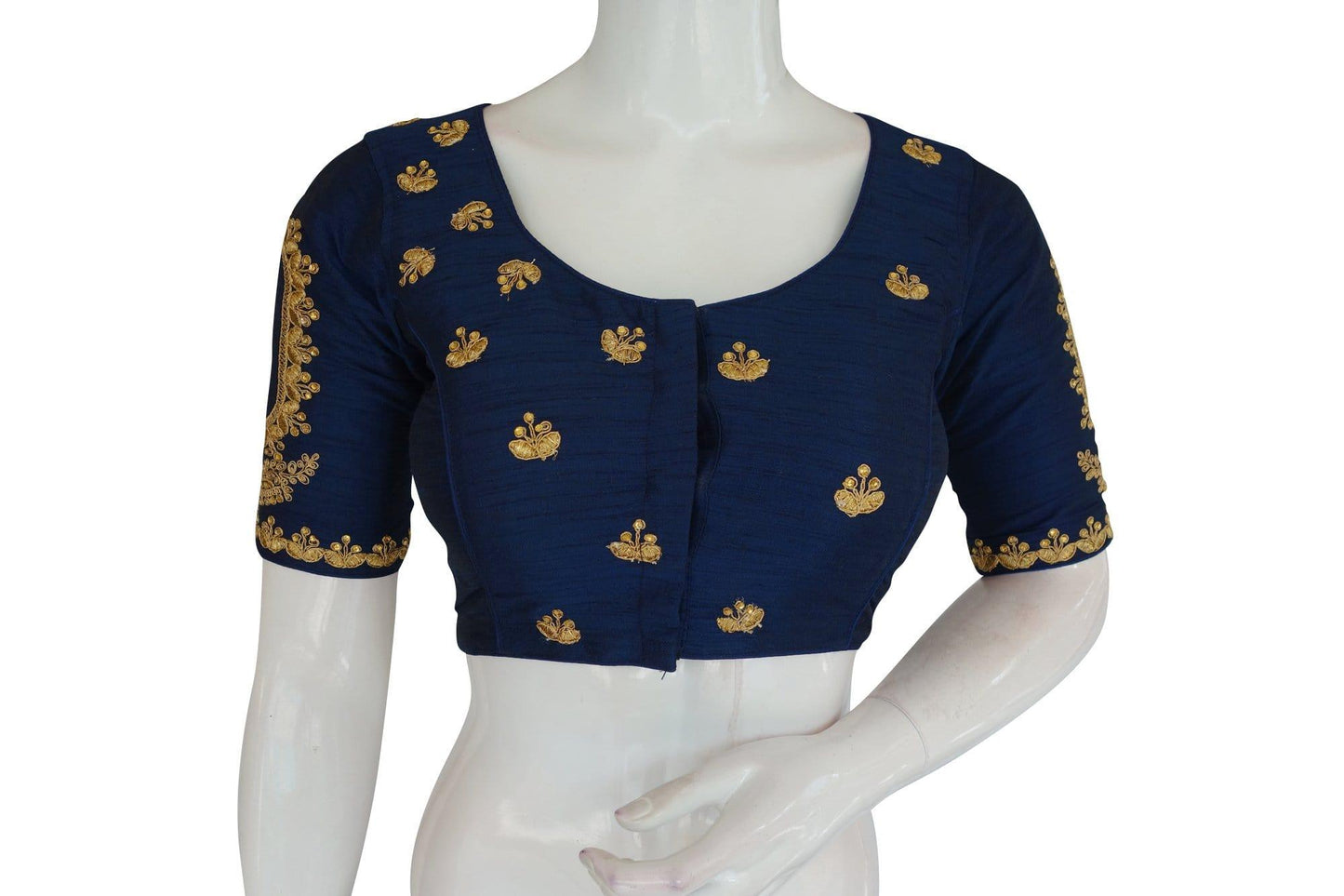 Enhance your ethnic ensemble with our Blue High Neck Embroidered Readymade Blouse, featuring exquisite mirror detailing and crafted in the traditional Indian crop top style, exuding elegance and sophistication.
