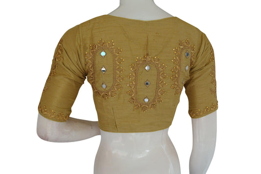 Enhance your ethnic ensemble with our Gold High Neck Embroidered Readymade Blouse, featuring intricate mirror detailing and a traditional Indian crop top design for a stunning and glamorous look.