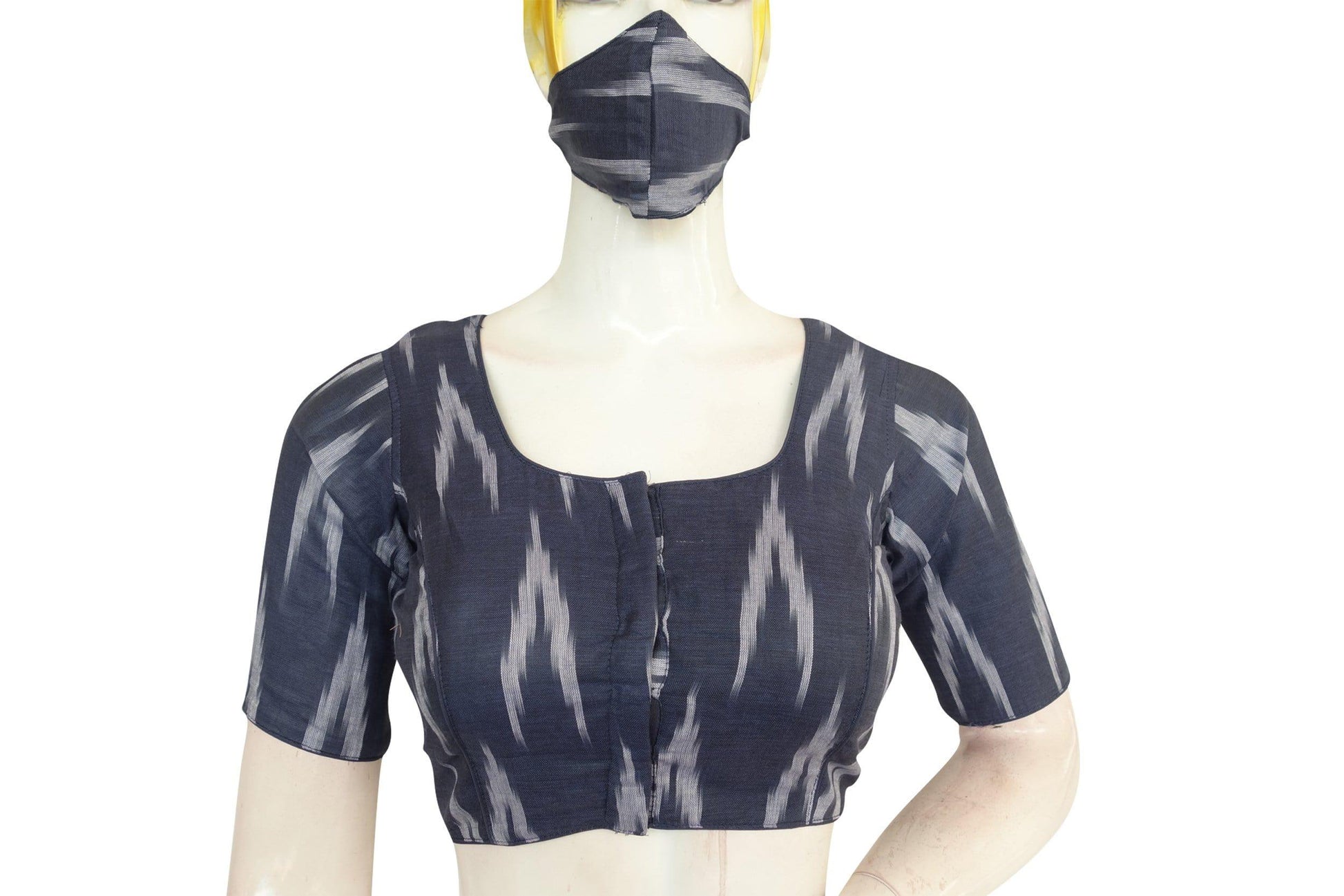 Stay fashionable and protected with our Navy Blue Ikkat Readymade Blouse, complete with a matching face mask for added safety and style. Elevate your look while staying stylishly safe.