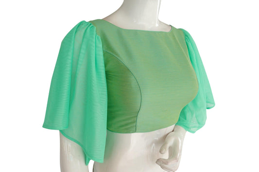 Indulge in perfection with "Pistachio Perfection," our Plain Silk Designer Ruffle Sleeve Readymade Blouse, exuding elegance and sophistication with its stylish design and graceful ruffle sleeves.