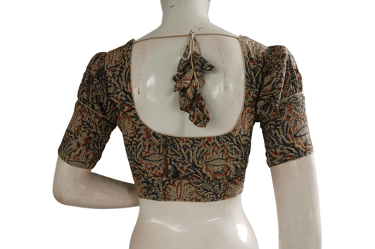 Add a touch of sophistication to your ensemble with our chic puff sleeve Kalamkari saree blouse. This ready-to-wear designer piece exudes elegance and charm, perfect for elevating your traditional look with ease.
